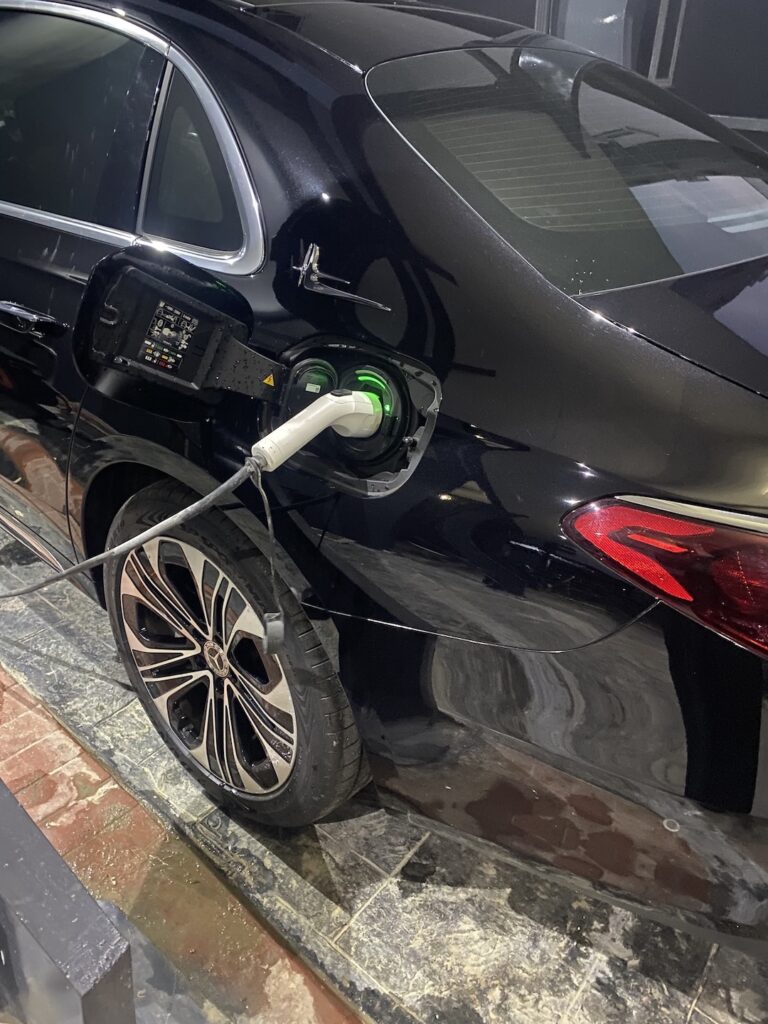 EV charging connector locked into a vehicle inlet in Abuja