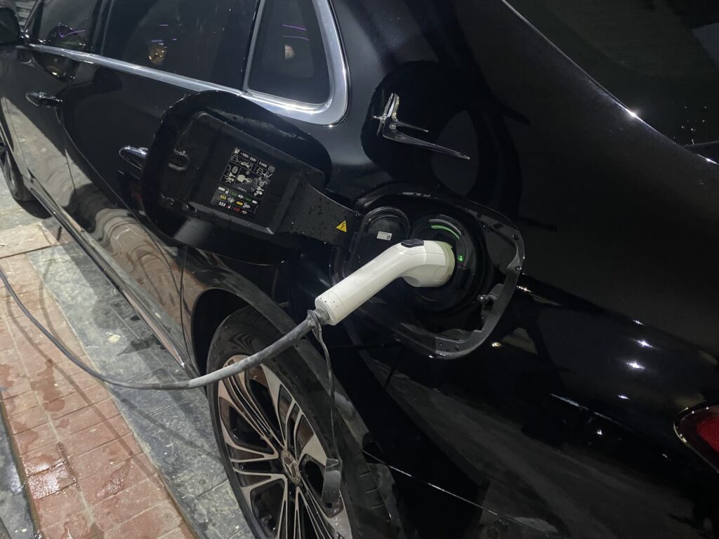 Type 2 connector plugged into an electric car in Abuja