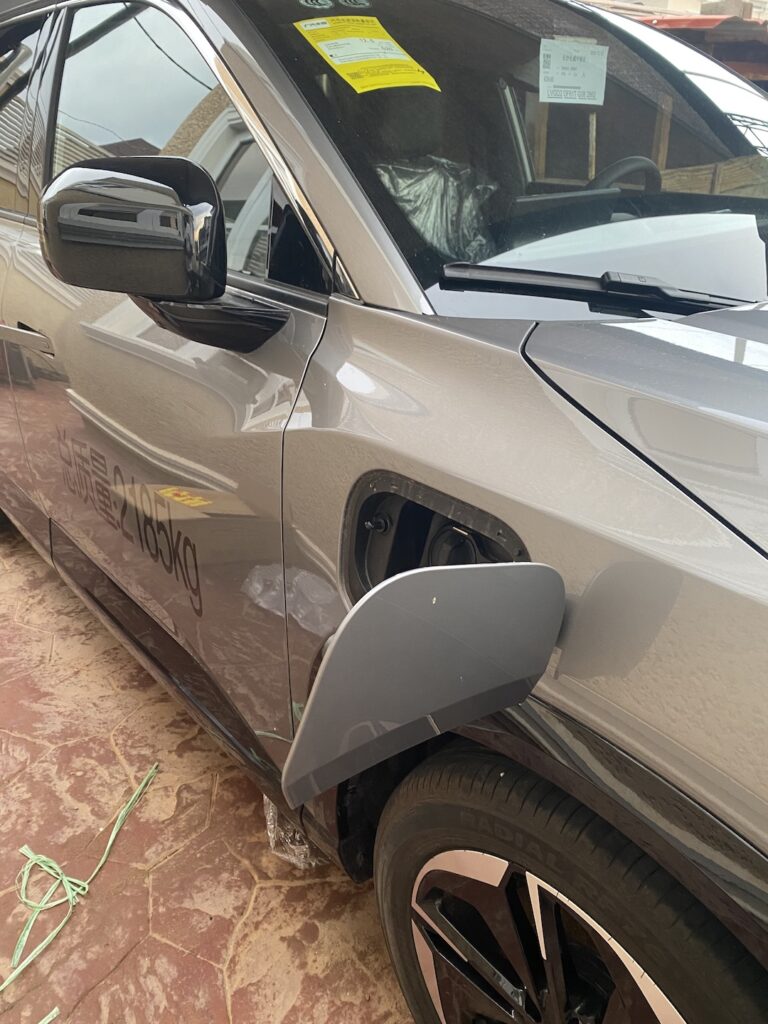 Charging port open on an electric vehicle in Abuja