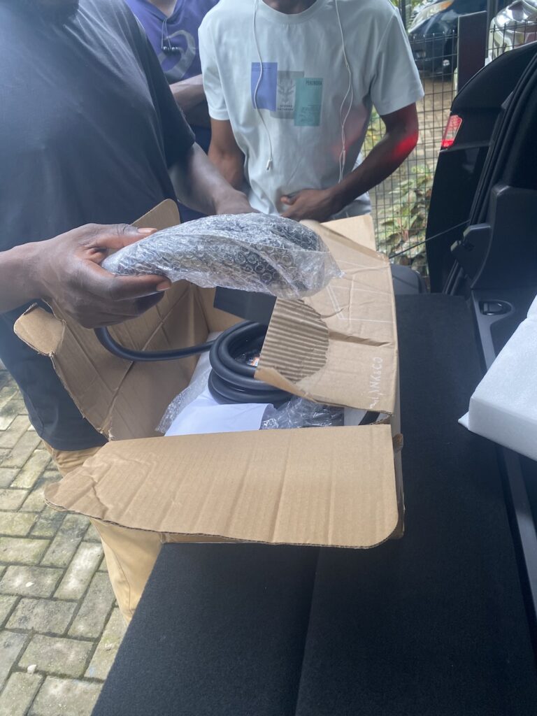 Unboxing a new EV charger before installation in Abuja
