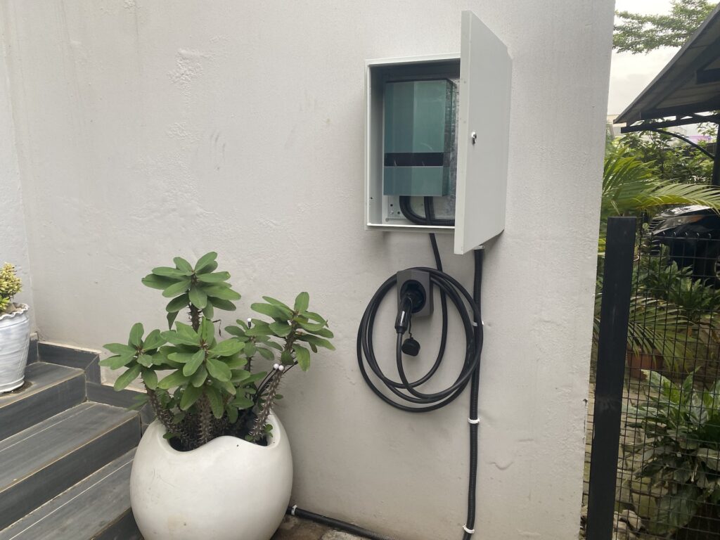 EV charger installed beside a planted courtyard in Abuja